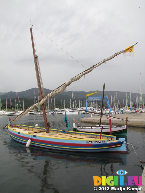 SX27573 Traditional Catalan sailboat in Argeles-sur-Mer harbour in the rain